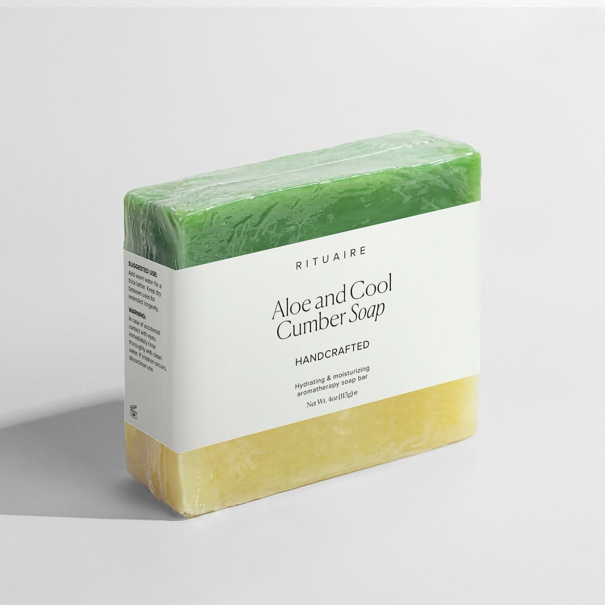 Rituaire Aloe and Cool Cumber Soap — sleeved bar beside an unwrapped bar